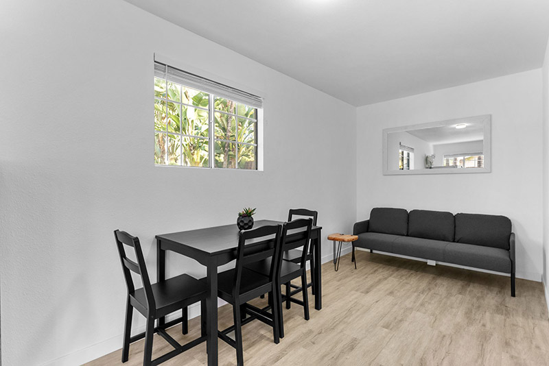 Living and dining area in the guest cottage with a sofa and dining table